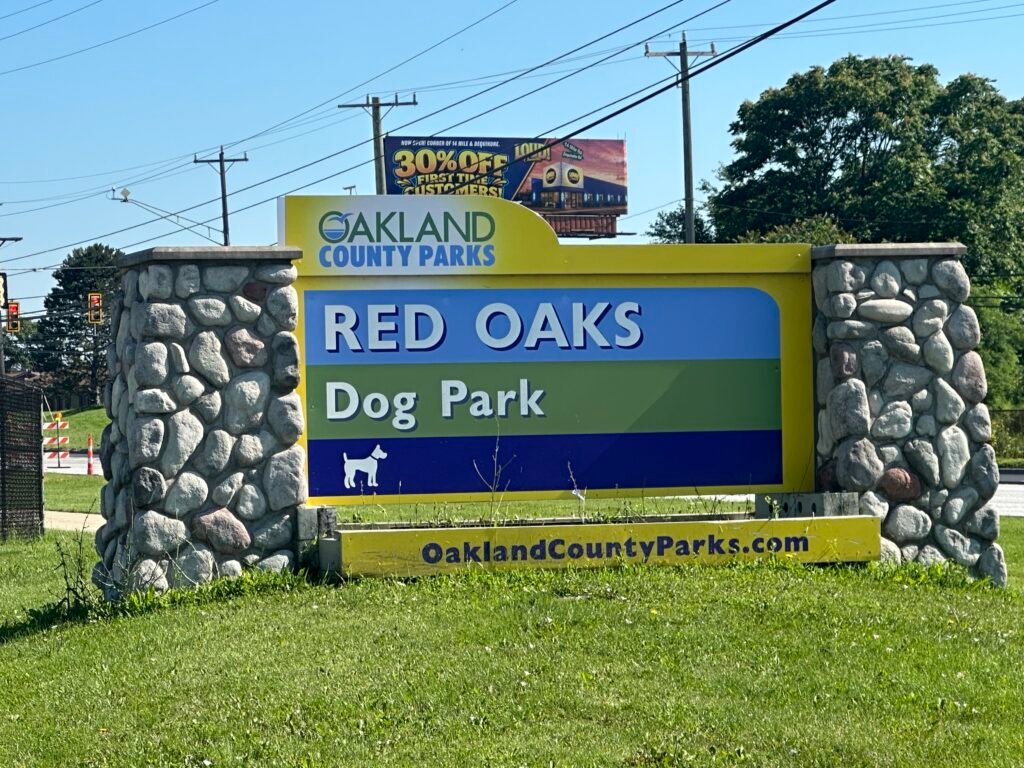 Red Oaks Dog Park sign as seen off of Dequindre Rd