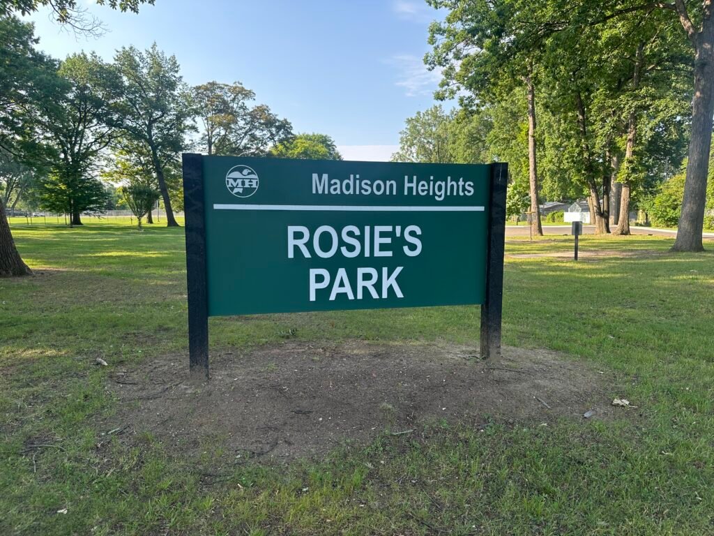 A sign for Rosie's Park Madison Heights