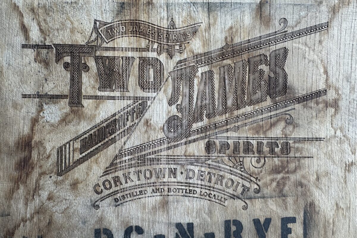 Two James Spirits logo burned into a wooden barrel head reading DC-N-RYE, Corktown, Detroit