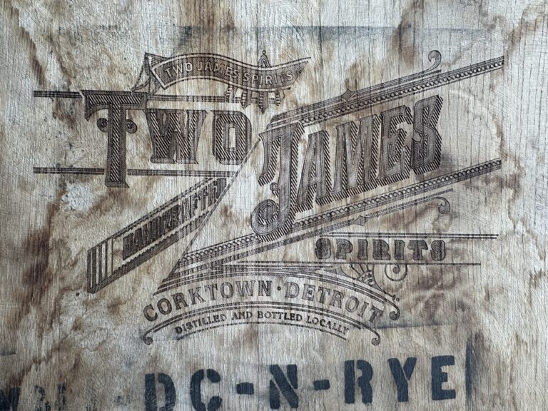 A barrel head inside of Two James Spirits Detroit distillery