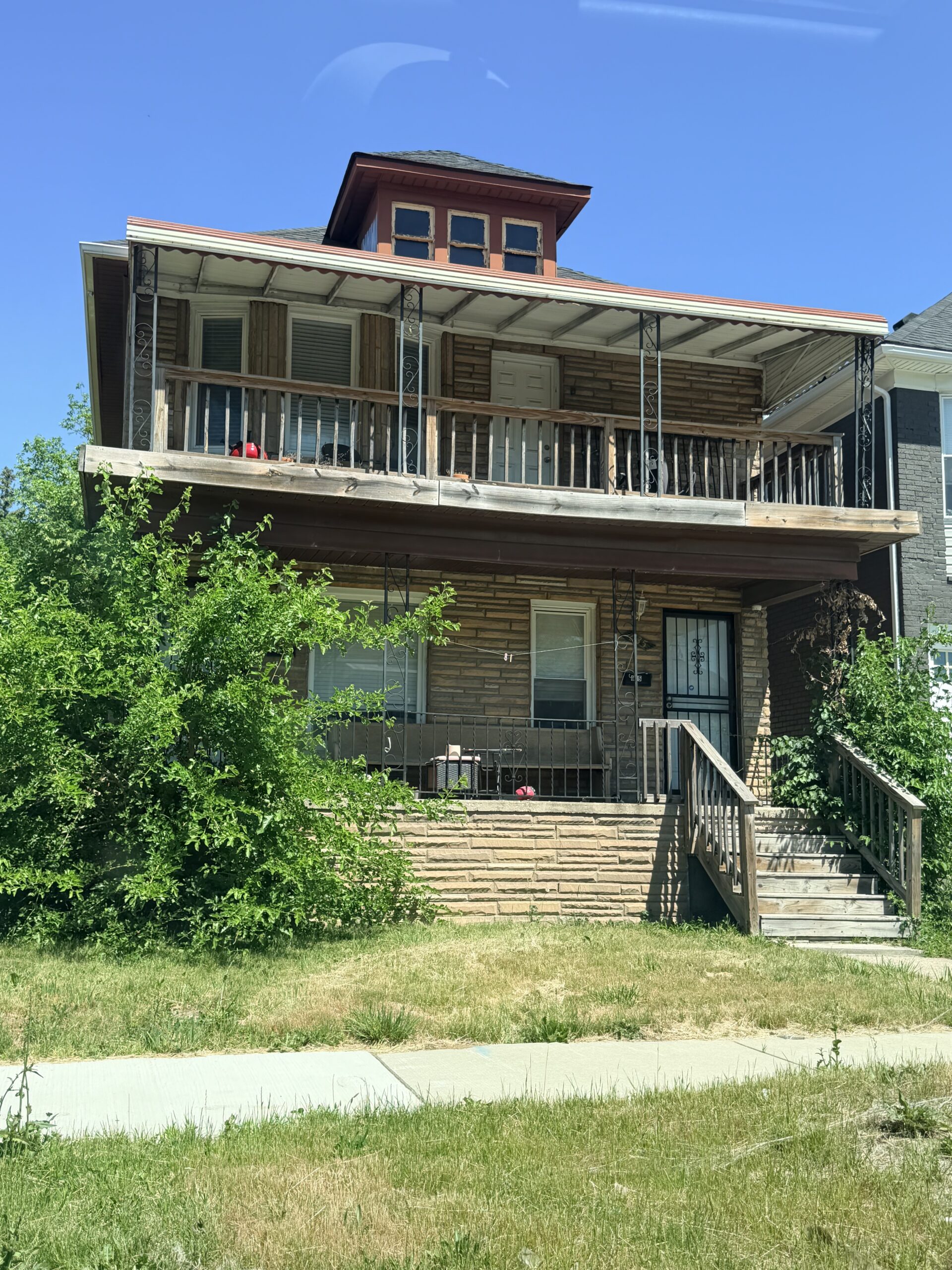 Diana Ross's childhood home on Belmont Street in Detroit's North End, a brick two-flat with an upper porch