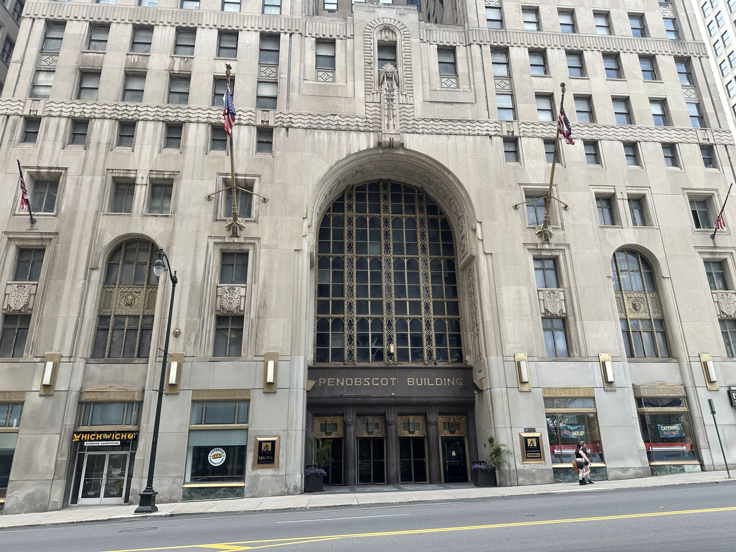 Arched four-story limestone entrance of the Penobscot Building on Griswold Street, downtown Detroit